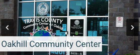 Oak Hill Community Center front doors, decorated with colorful stickers to welcome visitors.